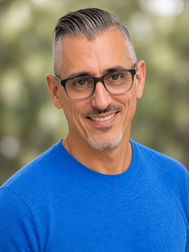 Tim Parkins outdoors in a blue tee
